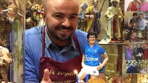 A Maradona-shaped puppet. Puppets like this are used in Christmas time to represent the birth of Christ, Napoli's ones are very famous for they irony and variety