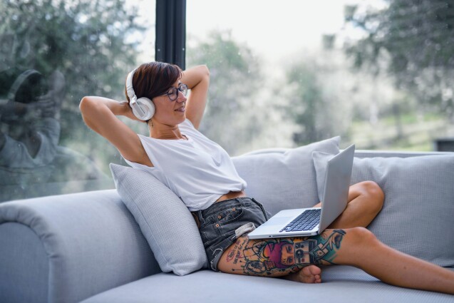 Woman on her coach listening to music
