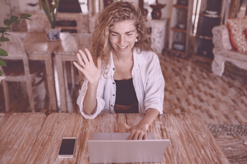 Woman talking online with her coach