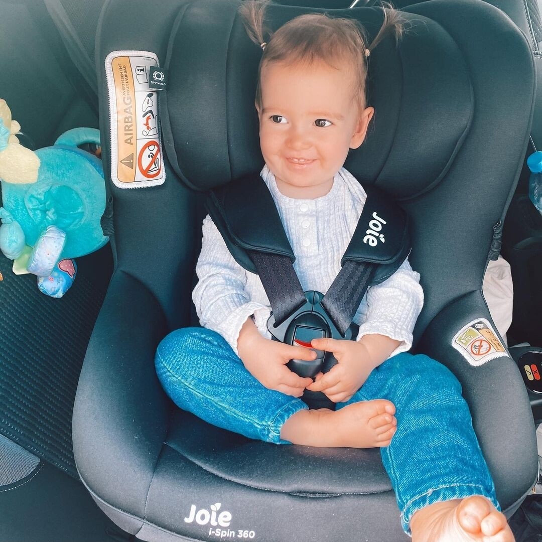 Emma in her carseat.