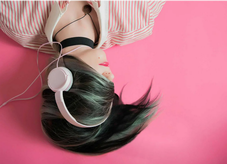 woman listening music with headphones