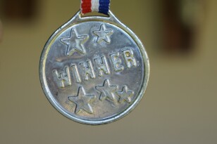 silver medal inscribed with