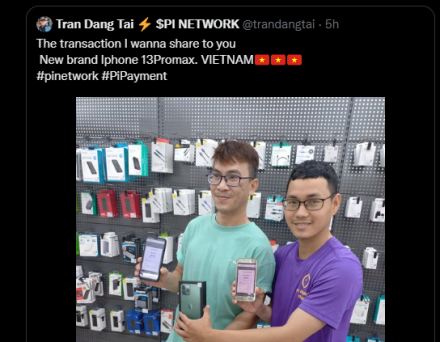 Two persons showing off their new mobile phone purchased with PI