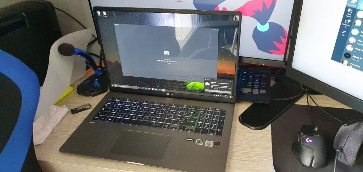 My new notebook (don't mind the mess and the Zoroark wallpaper on the other PC lol).
