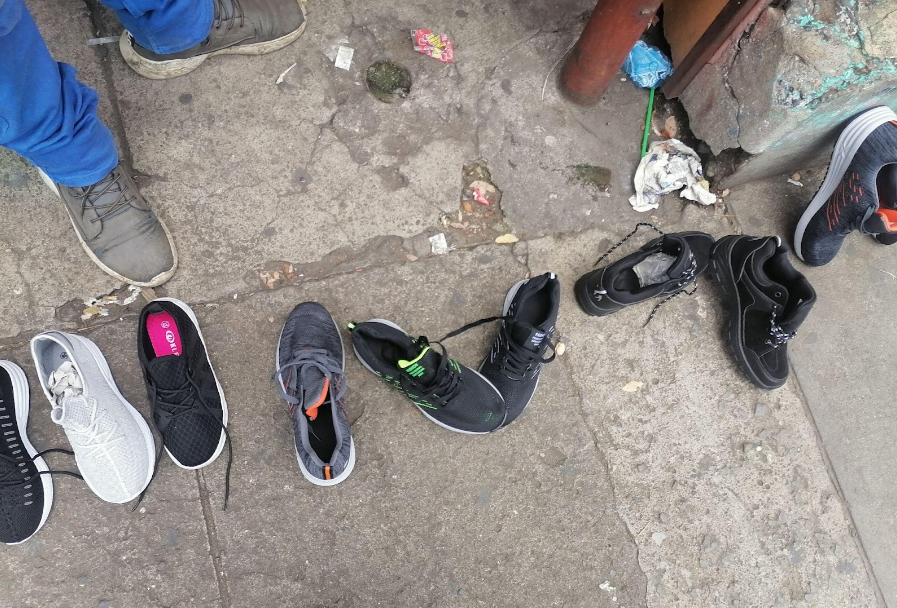 Street vendor sells shoes in Sonsonate