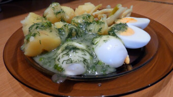 New potatoes in dill sauce with green beans and hard-boiled eggs