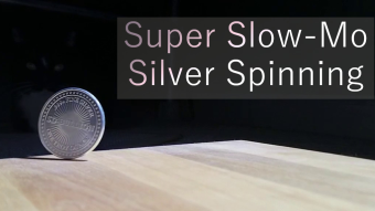 Spinning silver round slow motion video