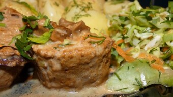 Pork tenderloin in cream and boletus sauce with spring salad