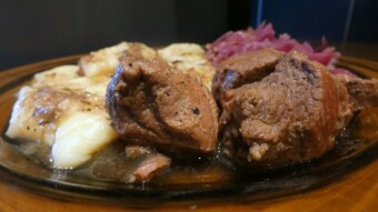 Wild boar goulash with dumplings and red cabbage