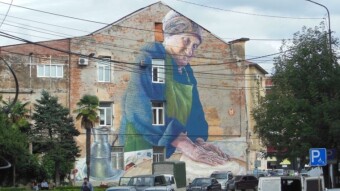 The queue in Kutaisi and the woman on the mural