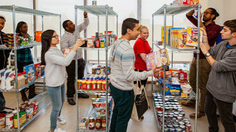 Man at food pantry declares “Bidenomics works!”