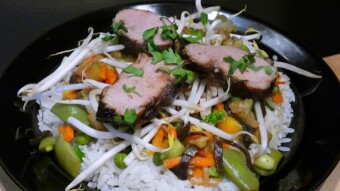 Duck breast in Asian-style ginger and soy sauce with vegetables and mushrooms