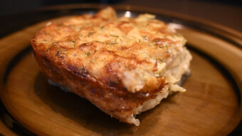 Zucchini casserole with yellow cheese and dill