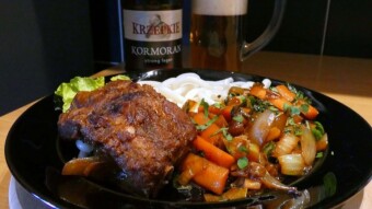 Pork ribs stewed in Teriyaki sauce with vegetables and beer from the brewery "Kormoran" "Krzepkie" Strong Lager