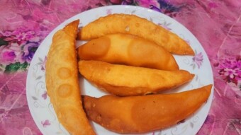 Vídeo de la receta de coco Jhuni Pitha