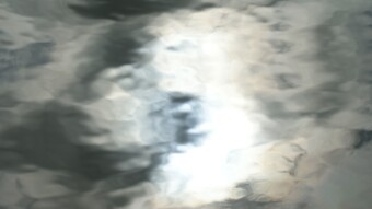 Lake Reflection: Clouds Reflect Face in Lake