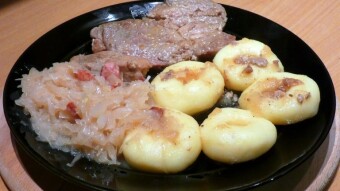 Roast pork with fried cabbage and Silesian dumplings