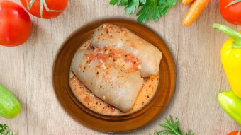 Stuffed cabbage rolls with meat and rice with garlic tomato sauce