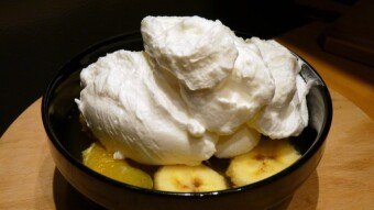 Jelly with grapes, banana, mandarins and whipped cream