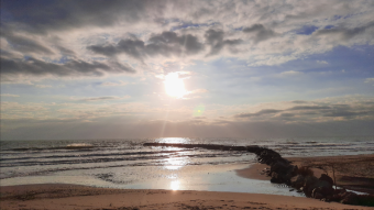I see fleeting clouds over the sea