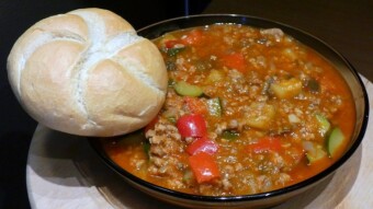 Homemade pork goulash soup with carrots, parsley and paprika