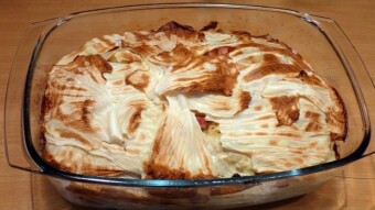 Potato casserole with bacon, sausage, and onion