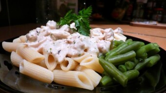 Chicken breast in cream sauce with noodles and green beans