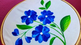 Handpaint with fabric color.
