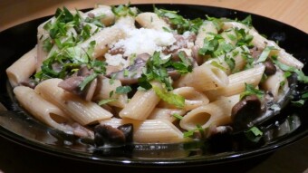 Home-grown mushrooms (champignons) in cream sauce with noodles