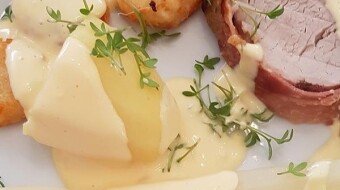 Fillet of pork rolled in bacon, coated with an onion-mustard-honey crust