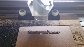 Laser etching my username into a keychain tag - Slow motion video