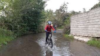 Crossing the Bike Through Water Pits and the Brave Little Girls  