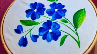 Handpaint with fabric color.