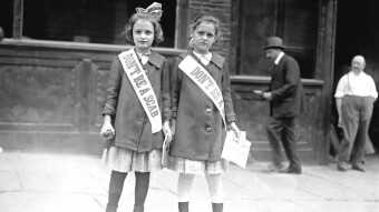 Two young strike sympathizers on roller skates distribute leaflets in Union Square, NYC, 1916
