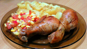 Juicy chicken in herbs, baked in a bag, with vegetable and Chinese cabbage salad