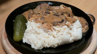 Barley groats with mushroom sauce and braised pork
