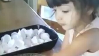 A disabled cute baby making cake without her hand