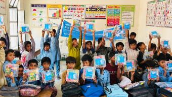 HTX Charity in Action: Delivering Warmth and Care to Children in Pakistan on Bitcoin Pizza Day