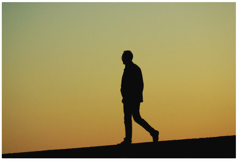 walking man absorbed in his thoughts.