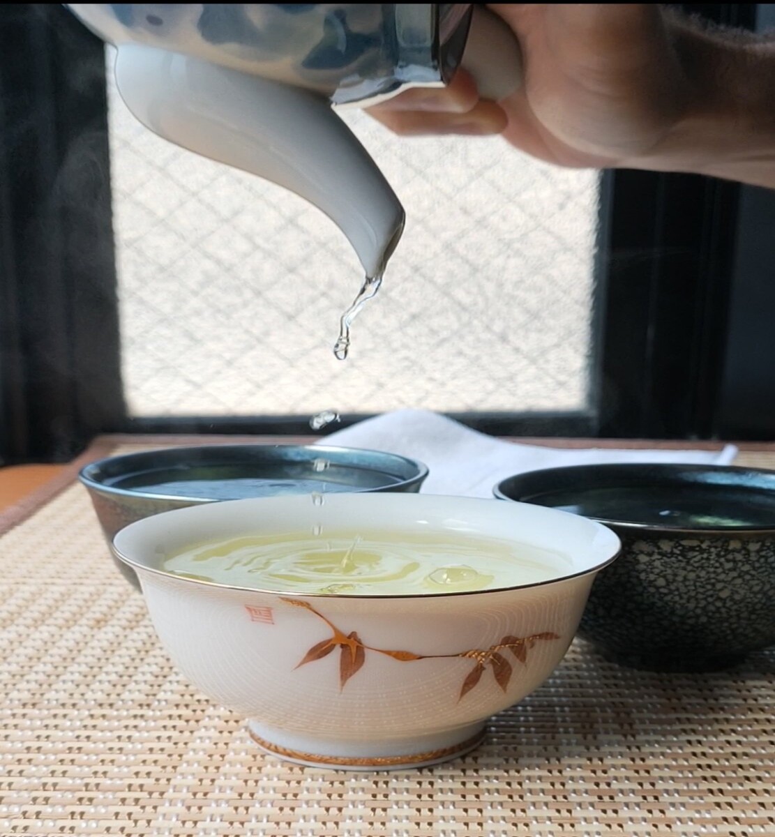 Pouring tea in a cup