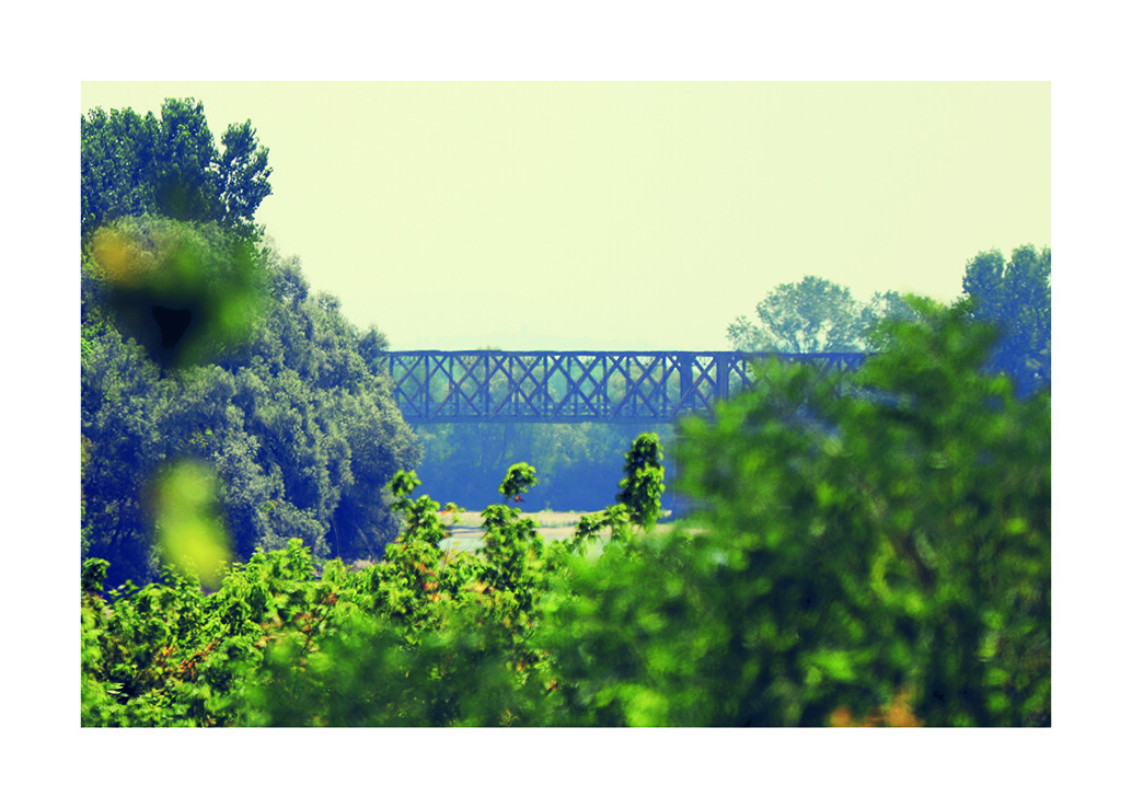 At the exact point where the two great rivers meet - Ticino and Po - the Becca bridge stands, an extraordinary man-made artefact built between 1910 and 1912 on a project by the Swiss engineer Jules Röthlisberger.  The bridge connects the city of Pavia to the hilly area called Oltrepo - literally