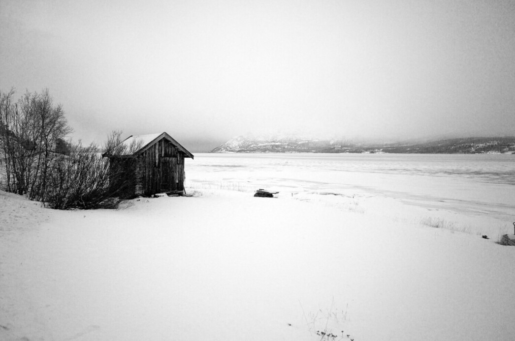 A hut near frozen lake in Alta - Norway.