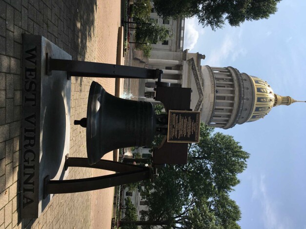 The north side of West Virginia's building features a replica of the Liberty Bell.