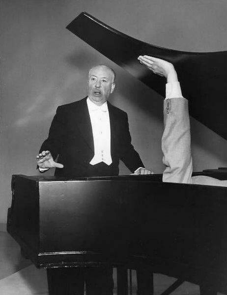 Alfred Hitchcock, performing a play for his audience