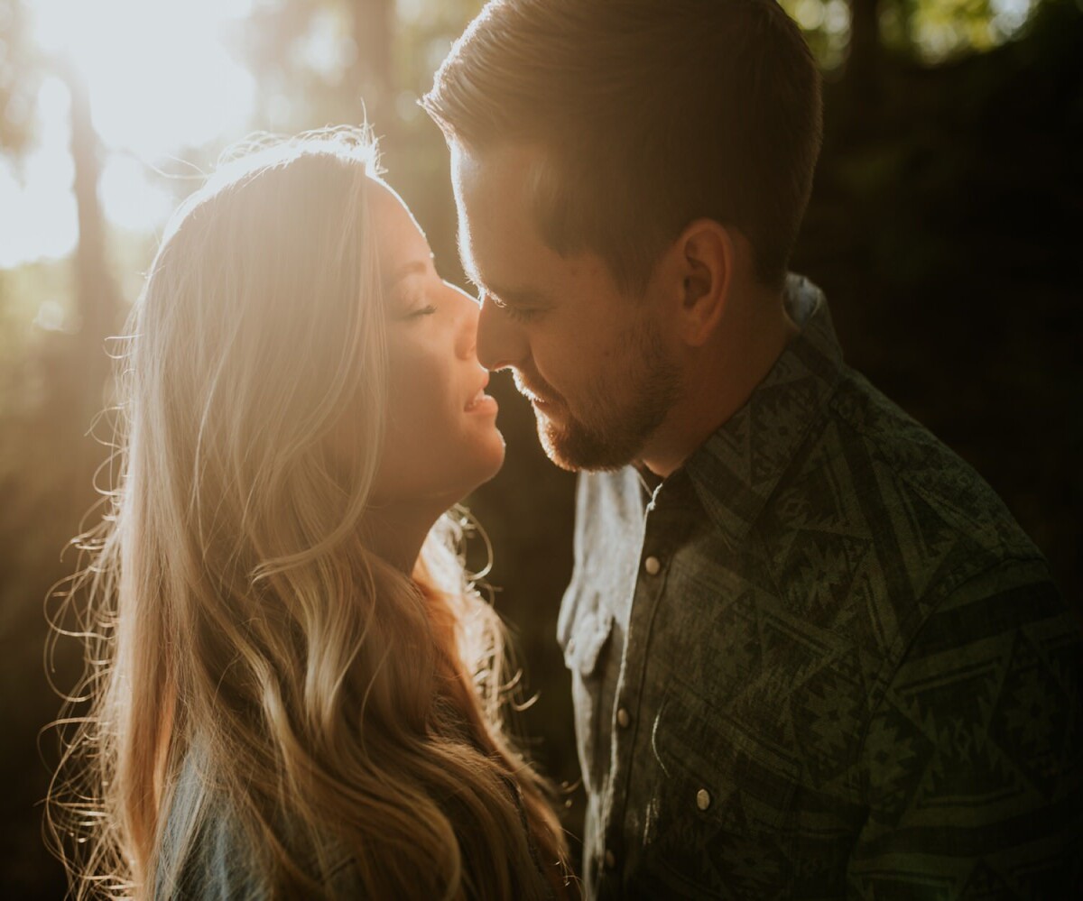 couple kissing at sunset at a park in indianapolis