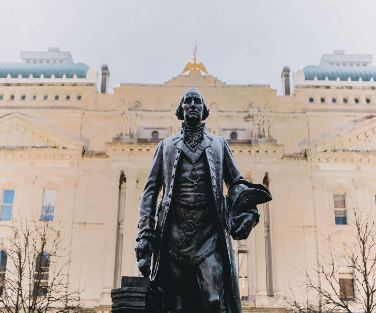 statue of george washington in front of indiana statehouse