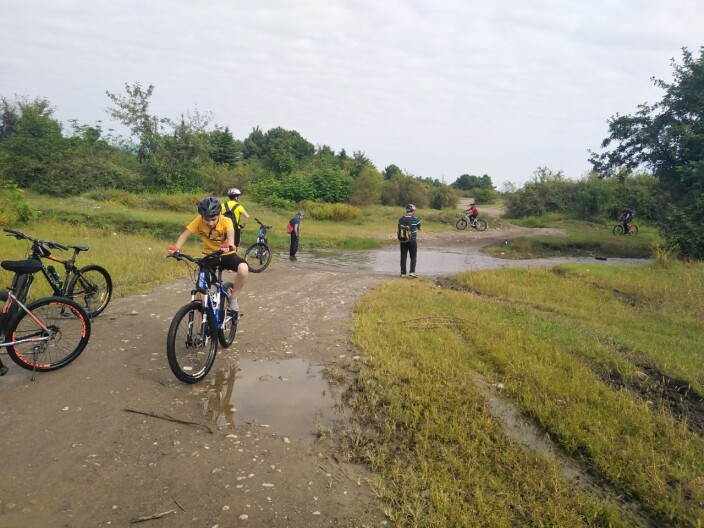 Crossing the Bike Through Water Pits