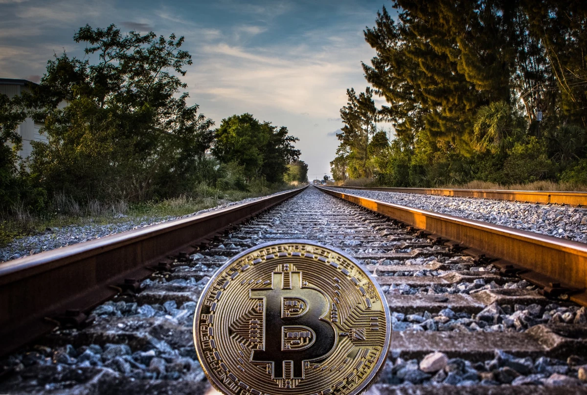 https://www.pexels.com/photo/gold-colored-bitcoin-on-railroad-1099296/