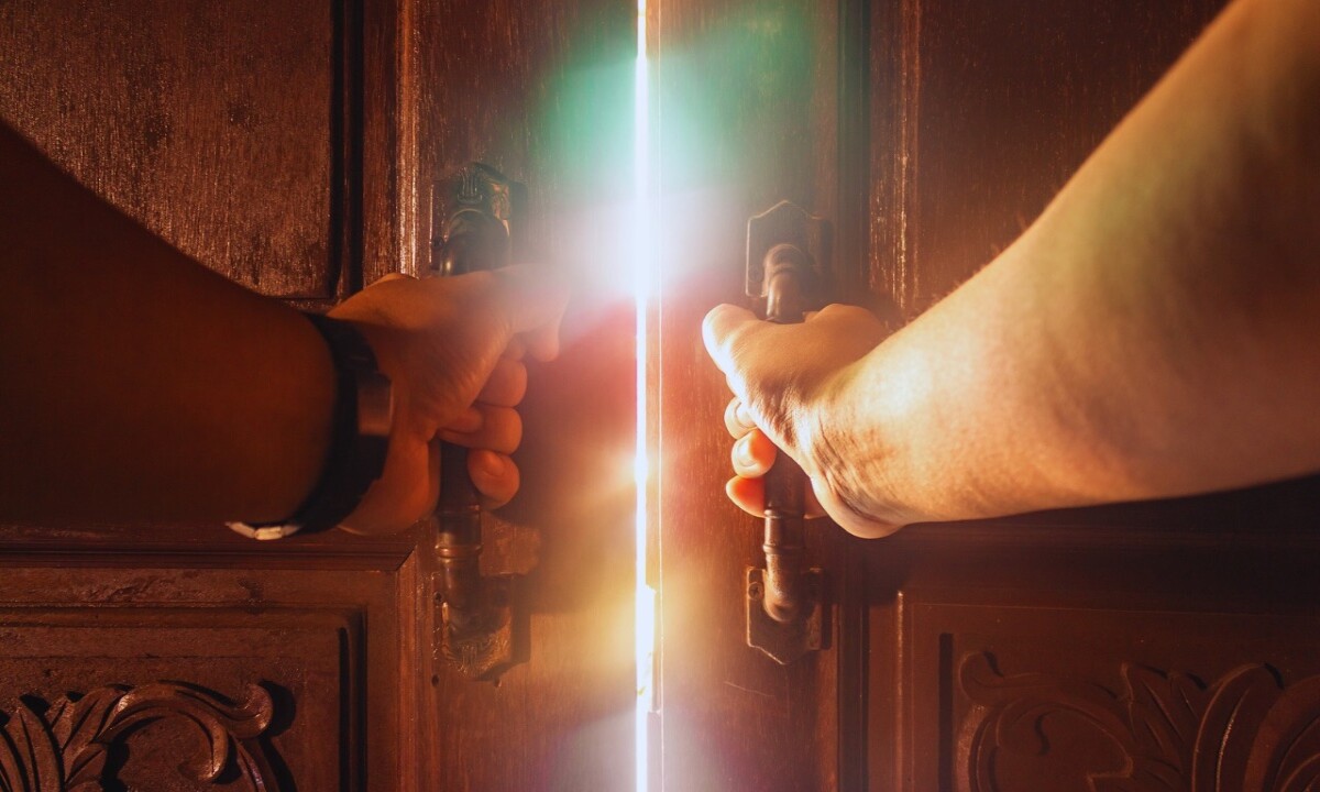 Opening door to new opportunities, stepping into the light of growth and self-discovery, symbolic of overcoming fears and embracing the unknown.