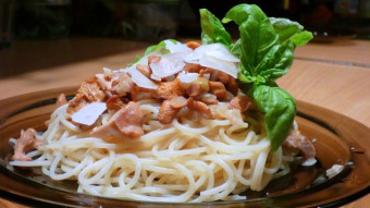 Chanterelles in a cream sauce with pasta, lemon basil and parmesan cheese